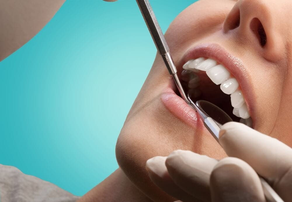 dental patient being examined for oral cancer by dentist